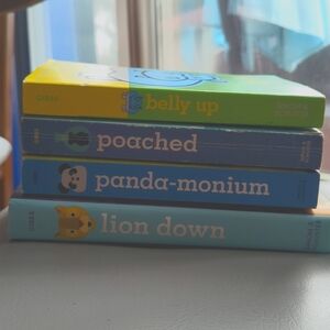 4 Stuart Gibbs books; Belly Up, Poached, Panada-monium & Lion Down